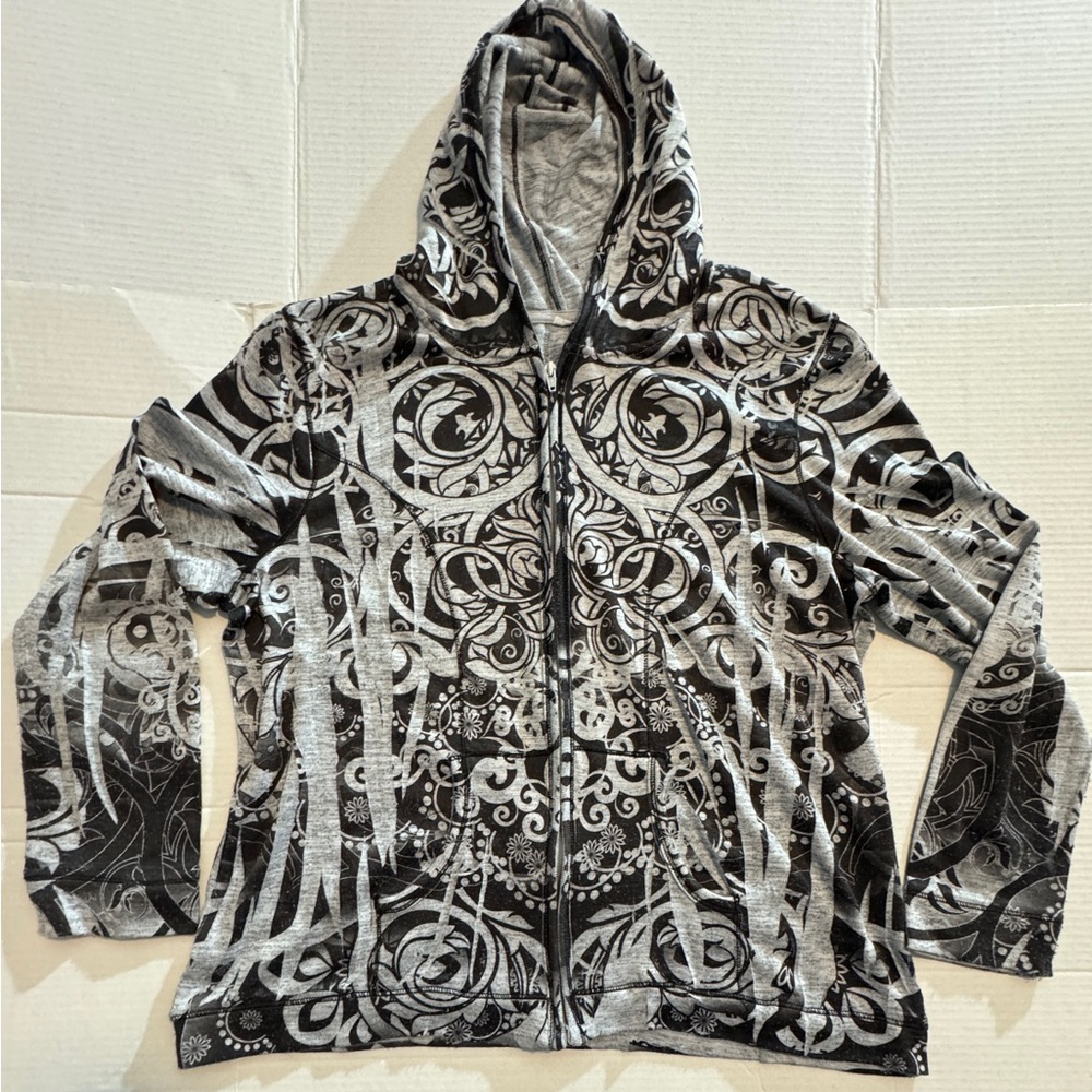 Gently worn woman’s lightweight zippered hoodie with design.